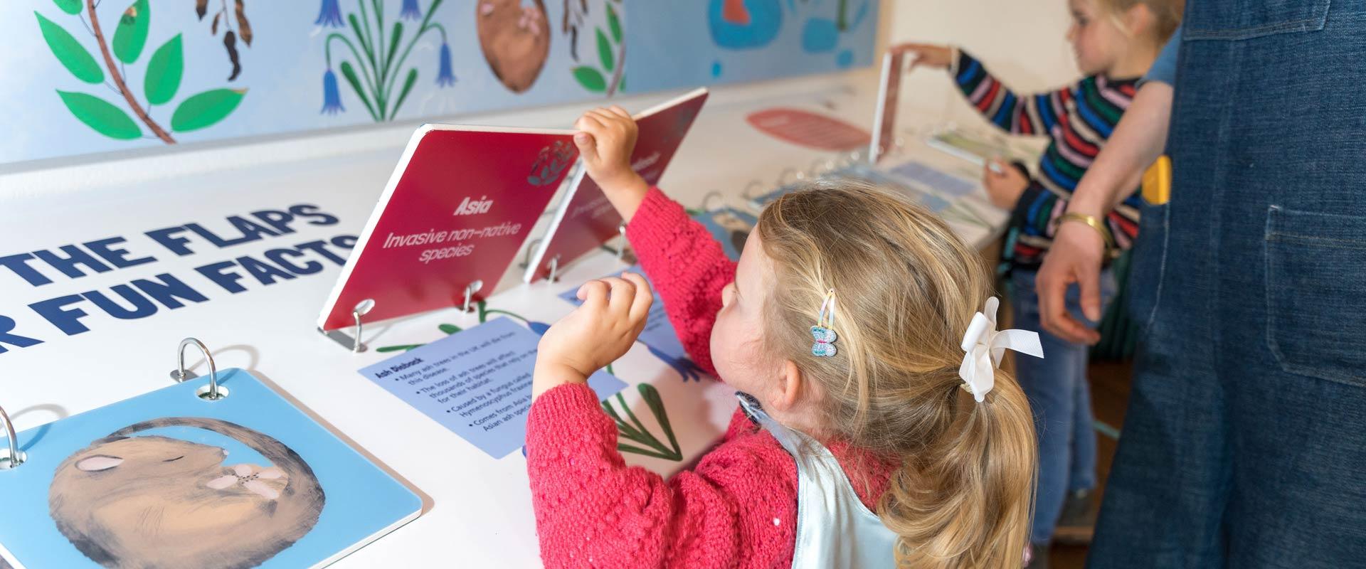 Young girls learning from interactive water exhibition