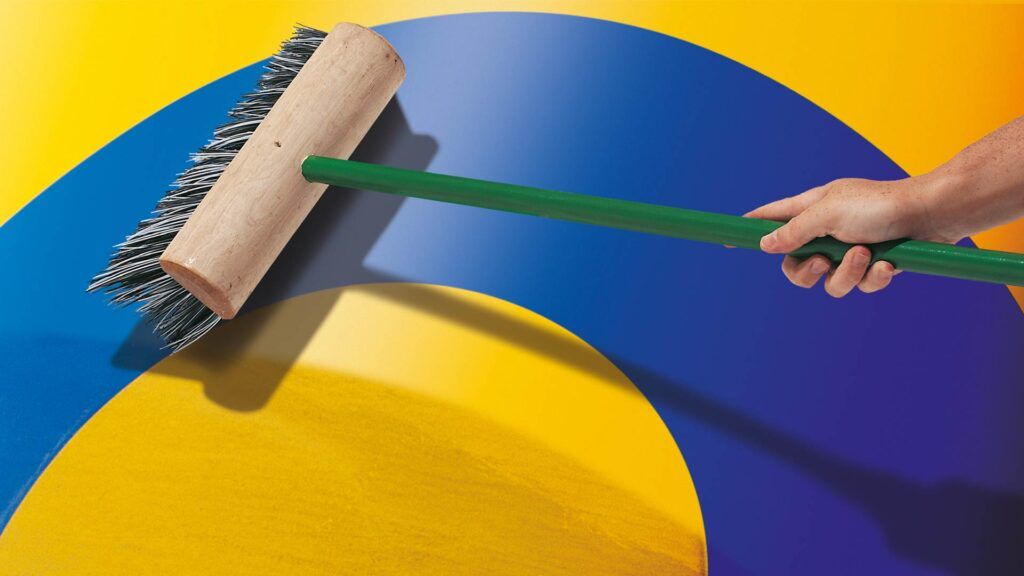 Blue Circle logo being swept by broom