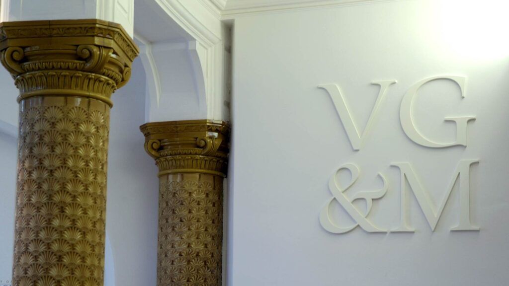 VG&M logo wall signage, pillars to the left