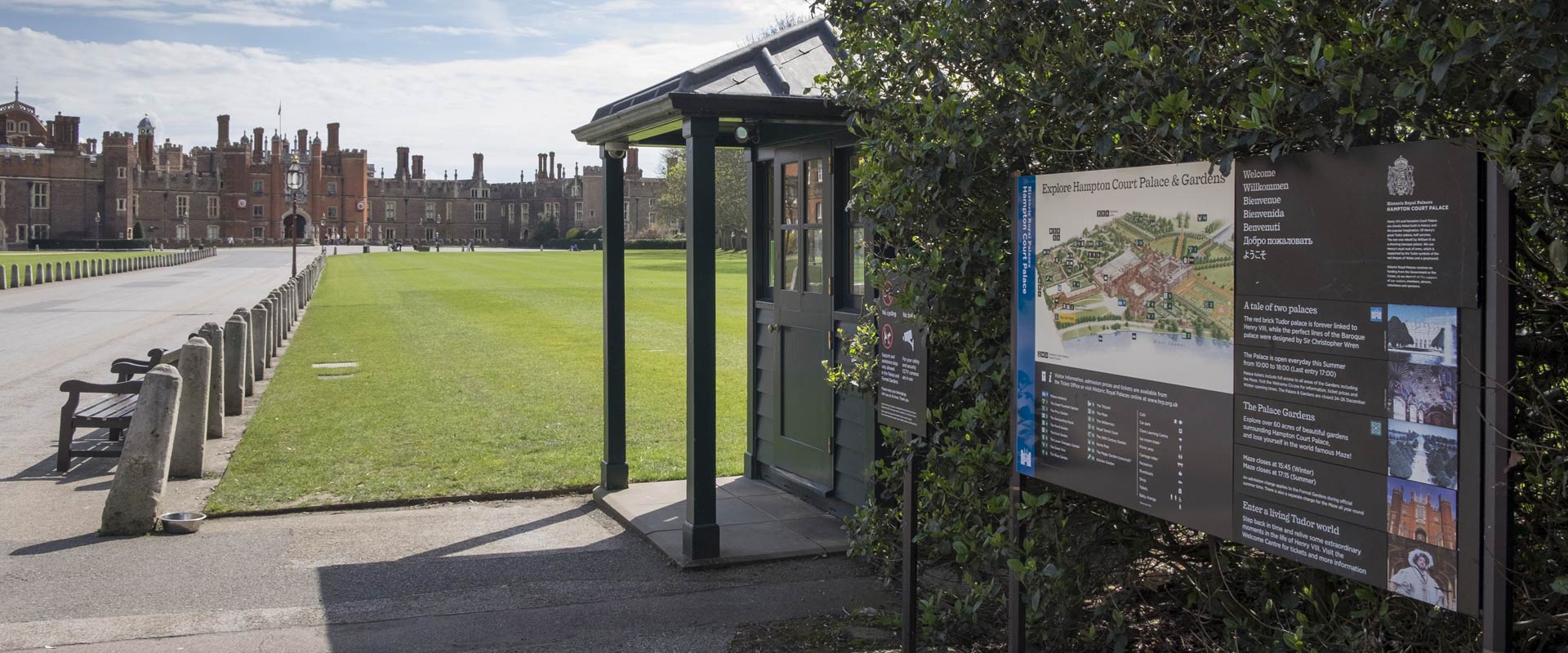 Hampton Court Palace & Gardens map and information sign, palace in the background