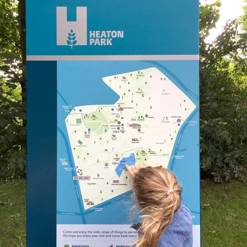 Young girl interacting with Heaton Park map signage