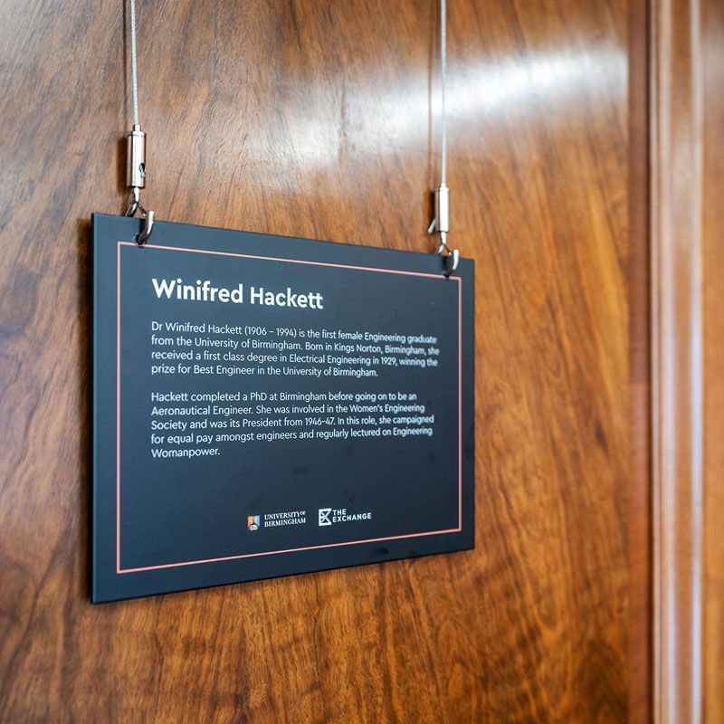 The Exchange Winifred Hacket biographical information floating signage